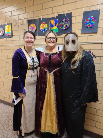 Teachers posing in costume