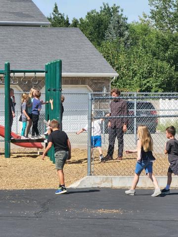 Mr. Hall playing at recess the first grade.