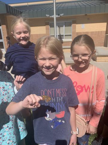 Third graders releasing butterflies after they learned about the life cycle of a butterfly.