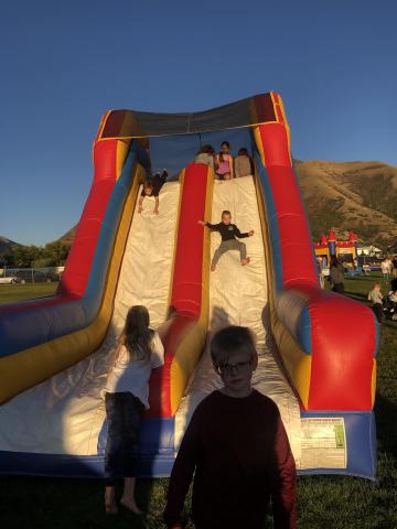 Kids having so much fun on the blow-up slides.
