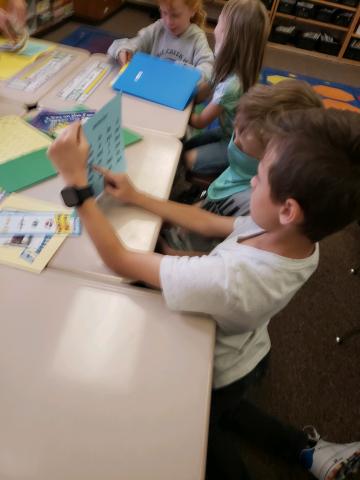 Fourth Grade helping First Grade with Addition 