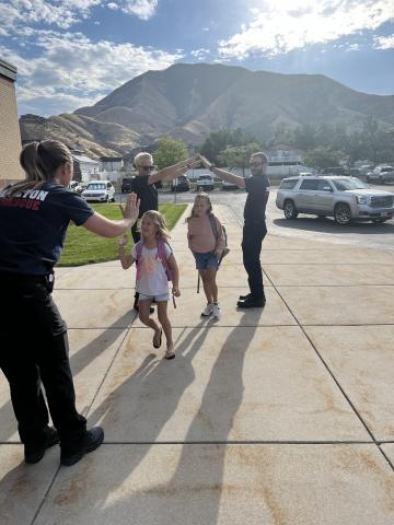 Students being welcomed to school from the Mapleton Fire Department.