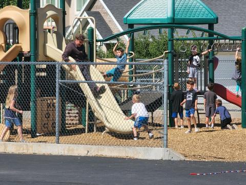 Mr. Hall playing at recess the first grade.
