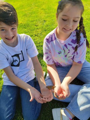 Third graders releasing butterflies after they learned about the life cycle of a butterfly.