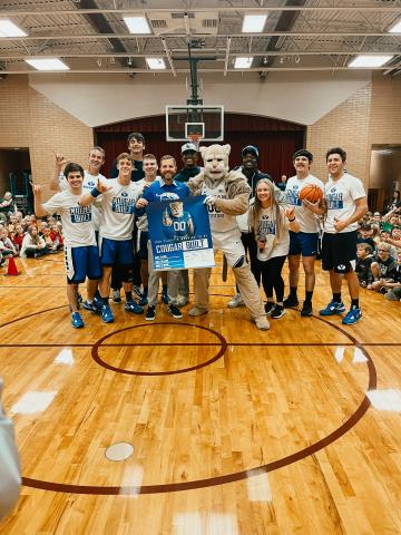 Mr.Sorensen with the BYU Dunk Team and Cosmo the Cougar