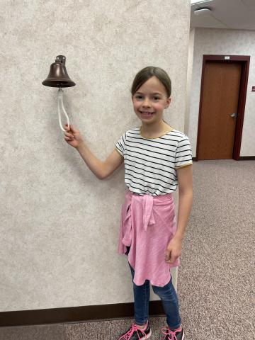 Brooke ringing the bell.