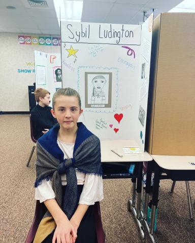 Fifth graders presenting at the wax museum.