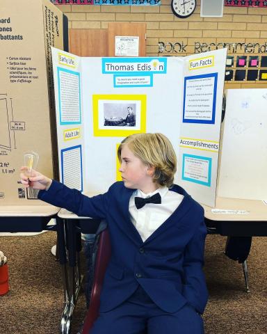 Fifth graders presenting at the wax museum.